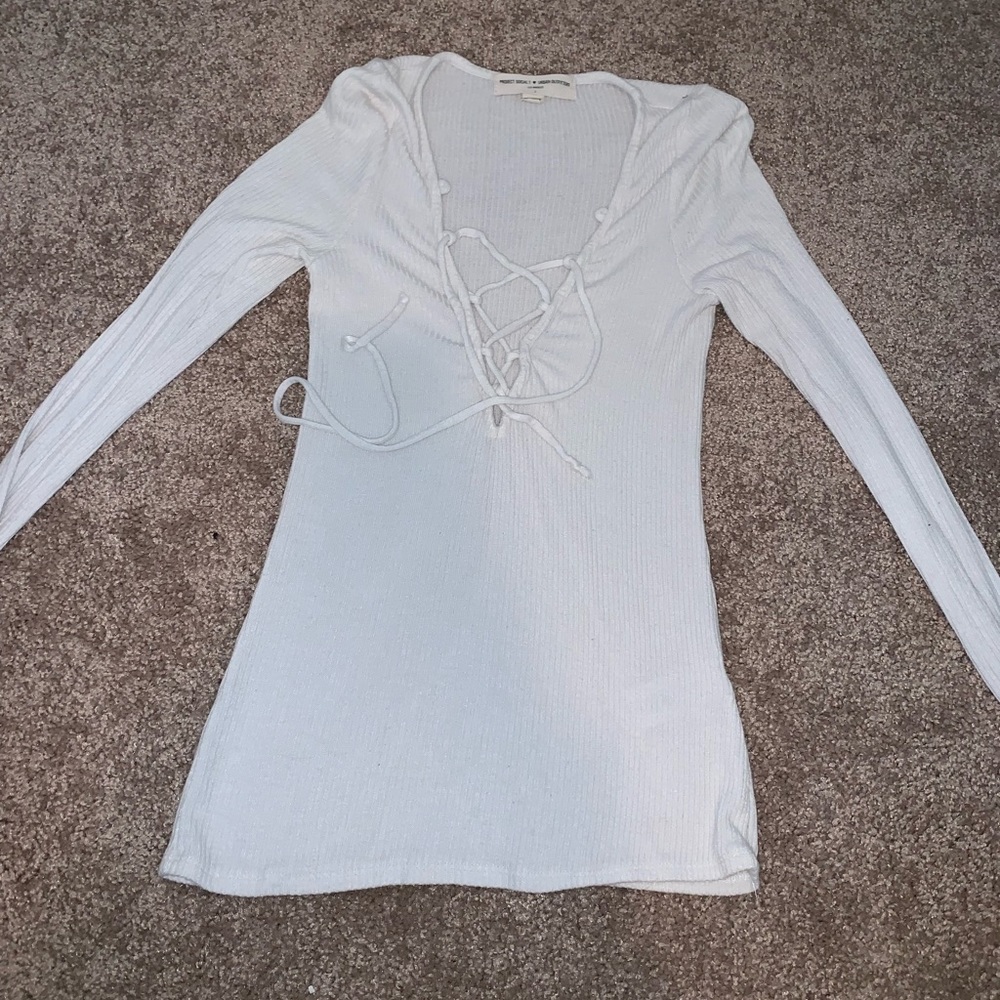 Long sleeve lace up front top